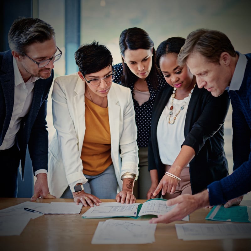 A group refines their ideas from a brainstorming session