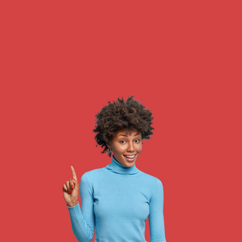 An African woman points up