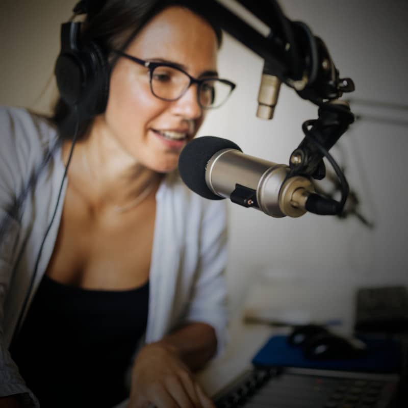 A woman recording a podcast