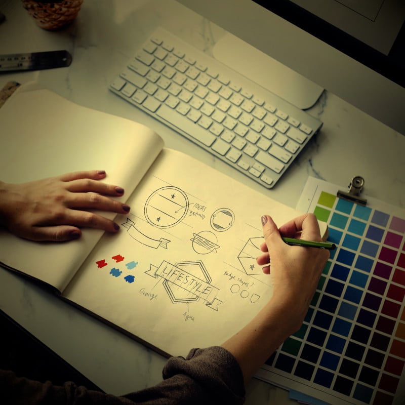 A graphic designer works on a website's design theme