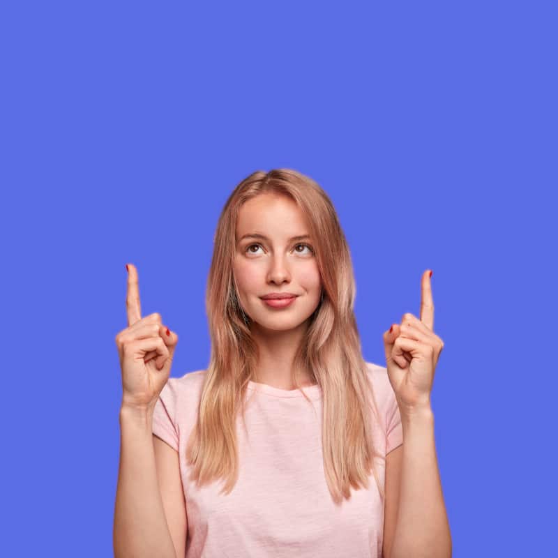 A woman points up on our Commonly Asked Questions (FAQ) page