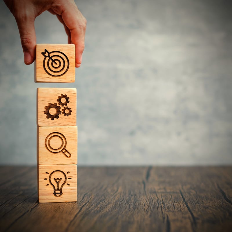 Stacking blocks as a metaphor for setting a website's key objectives,