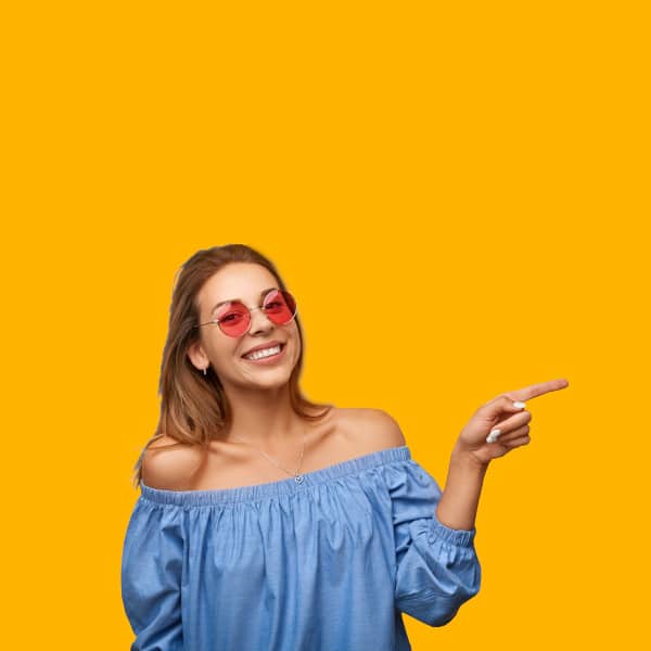 A smiling woman points out TheOneStopWeb.Shop's design philosophy