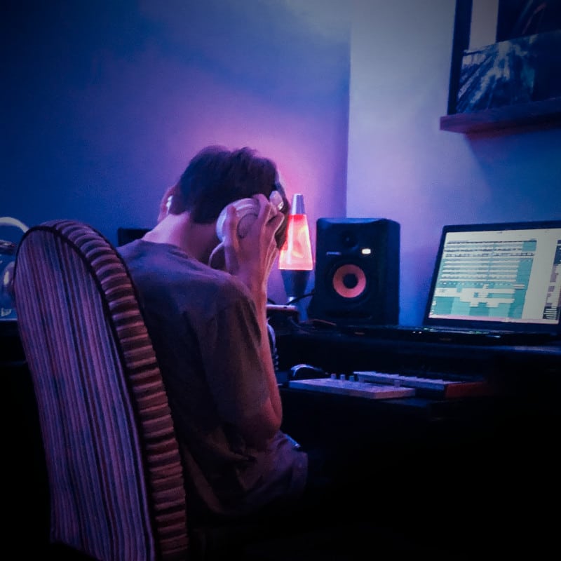 A man mixes audio for a video by TheOneStopWeb.shop