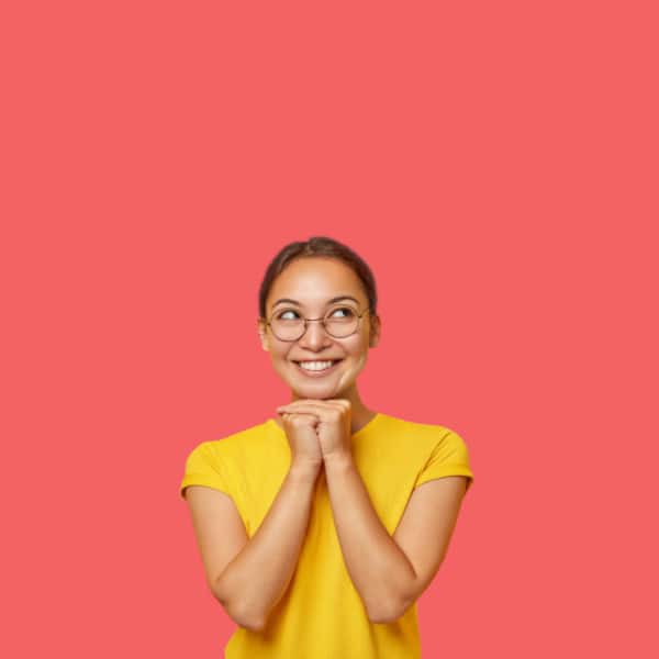 A smiling woman contemplates The One Stop Web Shop's six core services.